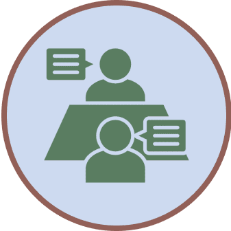 Icon of two people sitting across a table, each with a speech bubble, representing a conversation or interview.