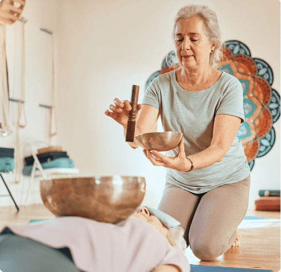 Registered nurse guiding a patient through a somatic experiencing session.